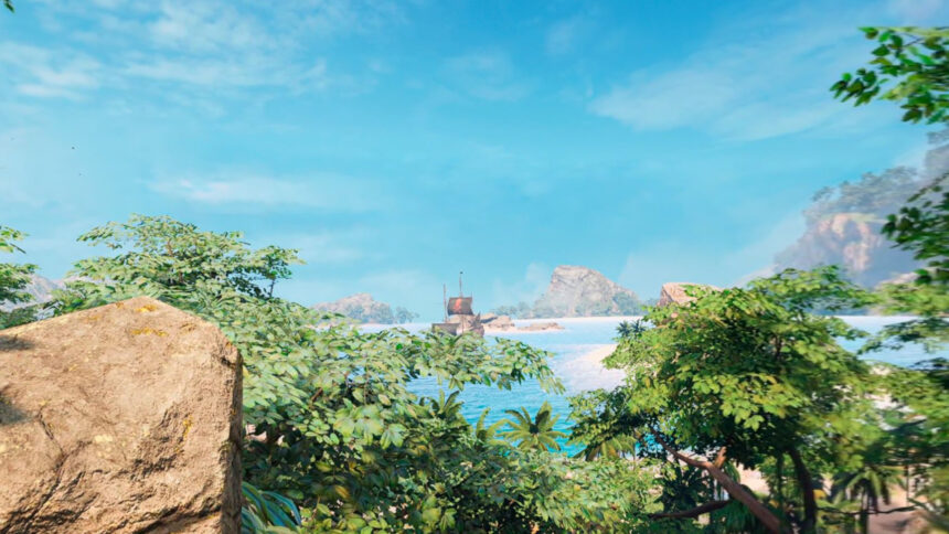 La vue depuis une falaise sur une île des Caraïbes montre des arbres, un ciel bleu et une baie où est amarré un navire.